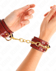 KINK - POLSINI JOANNA ANGEL ROSSO REGOLABILE CON CATENA ORO 16.5 - 26 CM X 4 CM - KINK WRIST RESTRAINT - Intimo per le occasioni speciali | The Game Lingerie