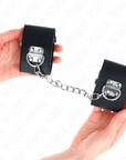 KINK - POLSO FISSO CON CATENA 30 CM E CHIUSURA LUCCHETTO NERO REGOLABILE 16 - 23 CM X 5,5 CM - KINK WRIST RESTRAINT - Intimo per le occasioni speciali | The Game Lingerie